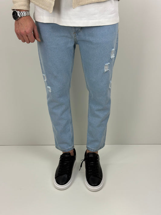 Jeans slim cropped con strappi